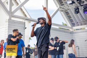 Rev Guy Jacques says the opening prayer for SonRise Music Festival Sat 9-13-2025 at 24th St Park in VA Beach, VA. Photo Annette Holloway Photography for SonRise