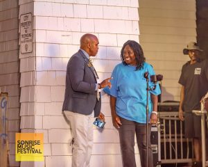 Councilmember Cash Jackson-Green talking to SonRise CEO Trina Keeny - SonRise Music Festival 9-13-2025 at 24th St Park in VA Beach. 4th St Park in VA Beach4th St Park in VA Beach